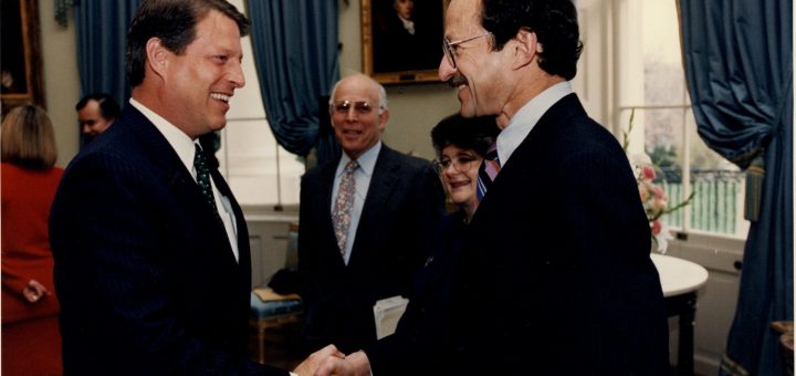 Harold Varmus shaking hands with Vice President Al Gore at the White House.