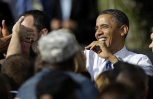 President Barack Obama greets supporters after speaking at a campaign stop Wednesday, Oct. 24, 2012 at the Mississippi Valley Fairgrounds in Davenport, Iowa.