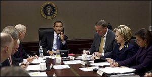 President Obama meets with members of his administration in the Situation Room.
