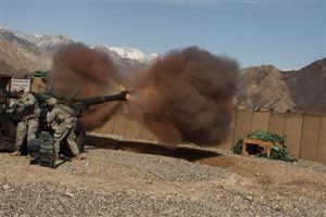 U.S. soldiers with the Army’s 1-6 Field Artillery Unit test fire an M198 Howitzer at a forward operating base in Kala Gush, Afghanistan, Monday, Feb. 16, 2009. (Photo credit: Spencer Platt / Getty Images)