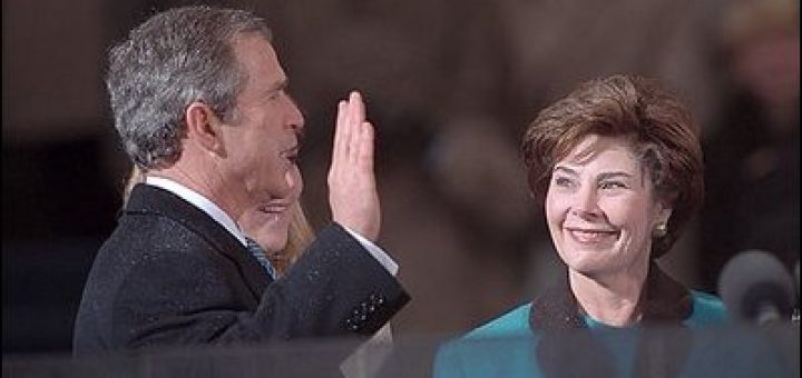 Photo of George W. Bush being sworn in as the 43rd President in an inaugural ceremony at the United States Capitol.