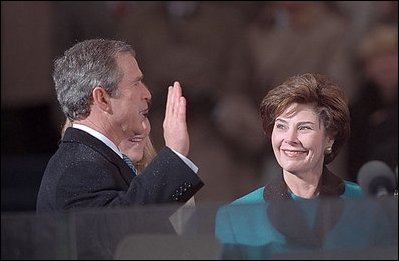 Photo of George W. Bush being sworn in as the 43rd President in an inaugural ceremony at the United States Capitol.