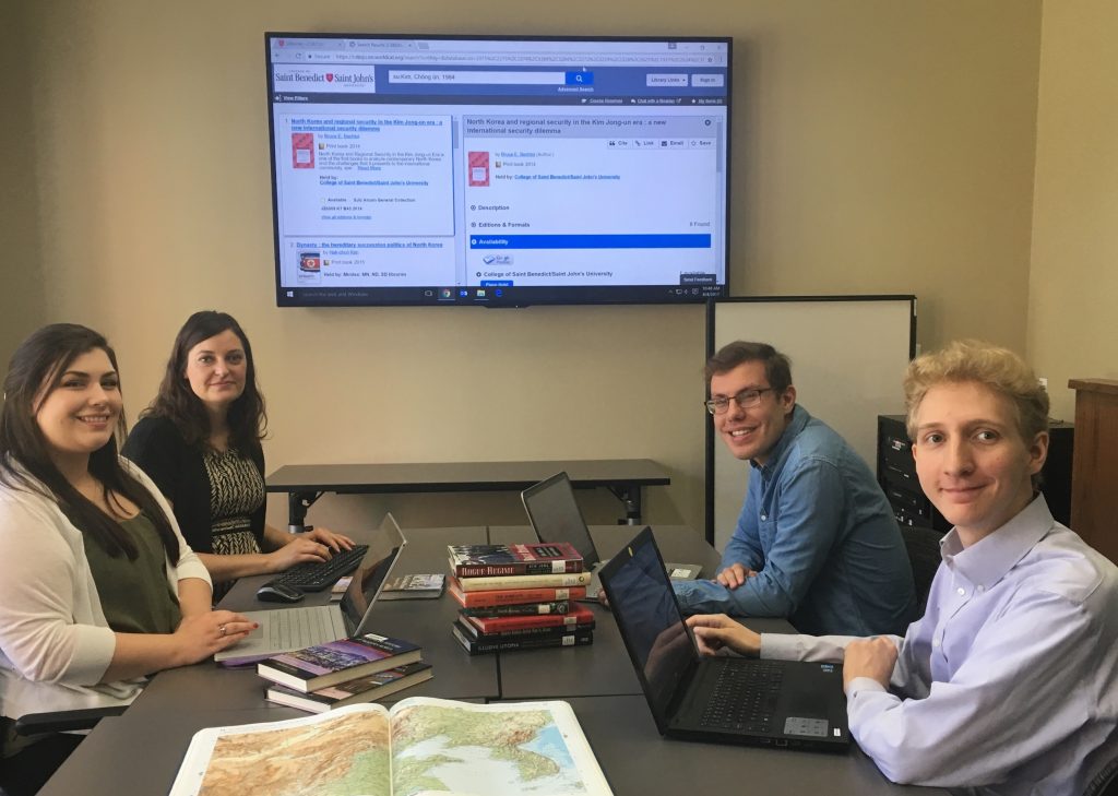Social sciences librarian Diana Symons instructs USPP summer research fellows Meghan Keaveny (front left), Jacob Wankel, and Jim Hasselbrink on bibliographic database searching for a North Korea threat assessment research project, Aug. 4, 2017.